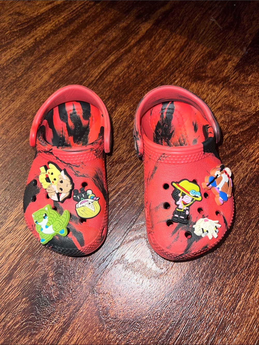 CROCS Kids Red and Black Marble Slip-On Sandals with Character Jibbitz